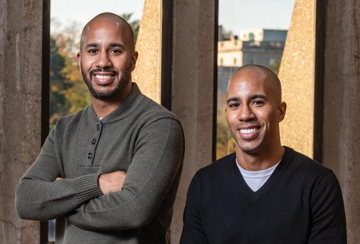 Desmon Lewis ’05 and Derrick Lewis ’06 photographed in the School of Theology and Ministry Library